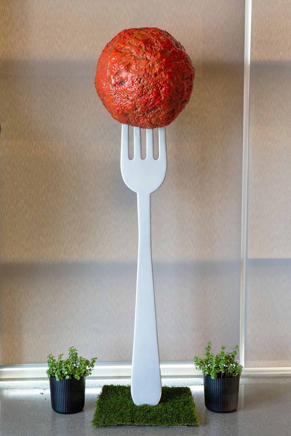 Giant fork and meatball prop sculpture